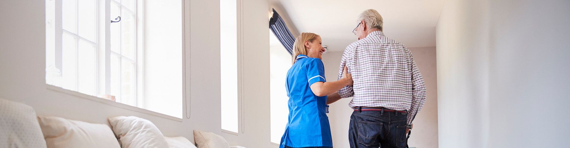 Nurse helping elderly man