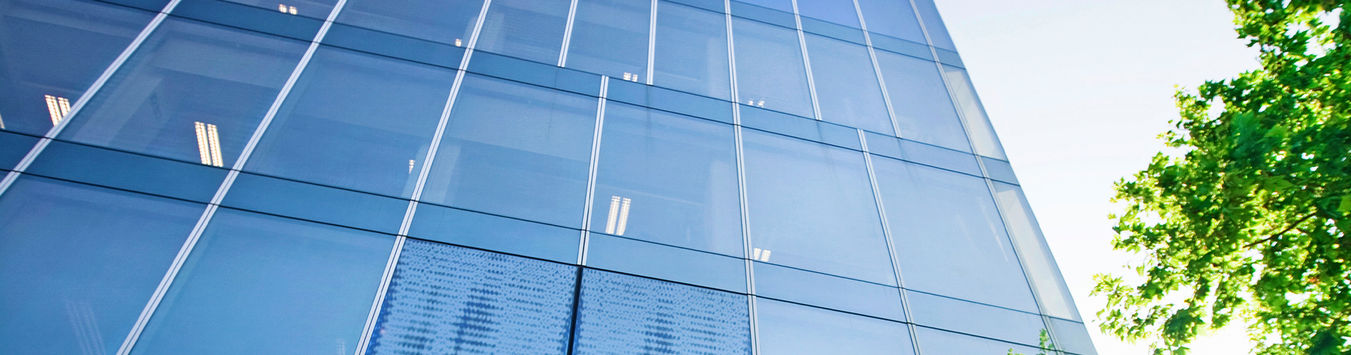 Glass building trees property 1900x500