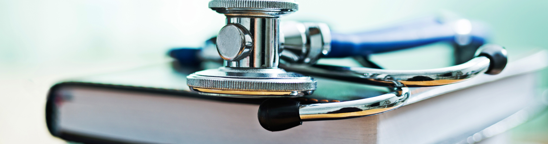 Health - medical stethescope on books 1900x500