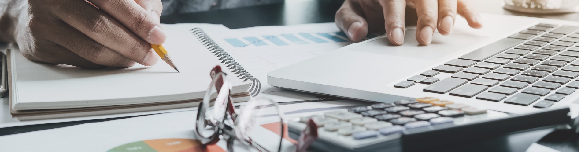 close-up-of-businessman-or-accountant-hand-holding-pen-working-making 360x240