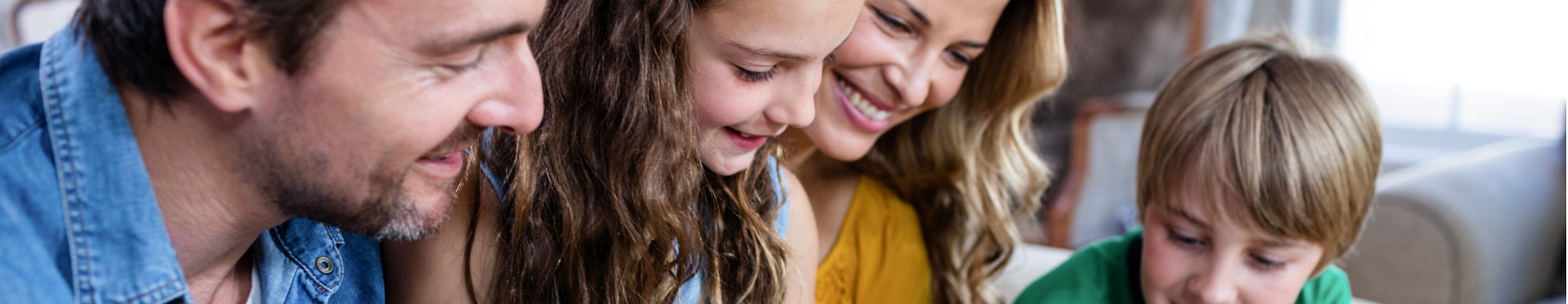 happy-family-looking-at-a-photo 1900 x 500