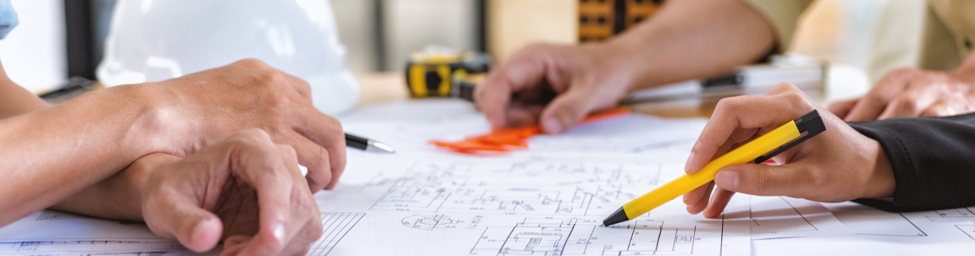 image-of-team-engineer-checks-construction-blueprints-on-new-project-1900x500