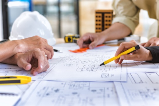 image-of-team-engineer-checks-construction-blueprints-on-new-project-540x360
