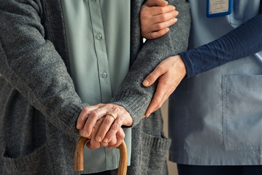 nurse-assisting-senior-with-walking-cane.jpg-540x360