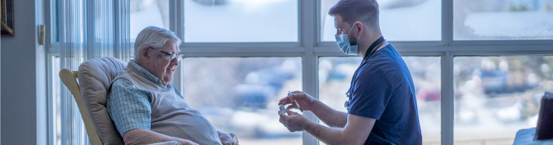 nurse-gives-vaccine-injection-to-senior-man 1900x500