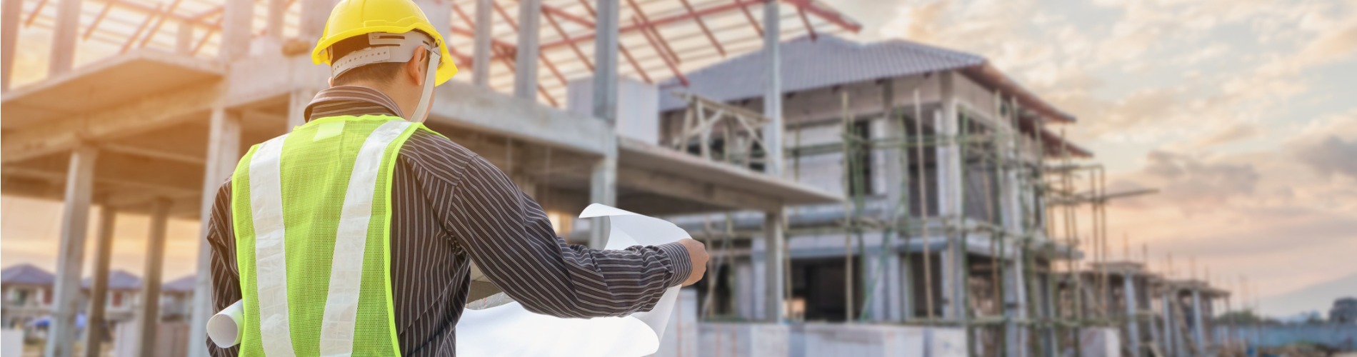 professional-engineer-architect-worker-with-protective-helmet-and-blueprints-paper-at-house-1900x500