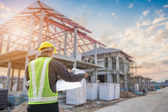 professional-engineer-architect-worker-with-protective-helmet-and-blueprints-paper-at-house-540x360