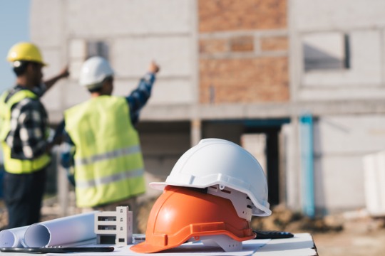 structural-engineer-and-architect-working-with-blueprints-discuss-at-the-outdoors.jpg-540x360