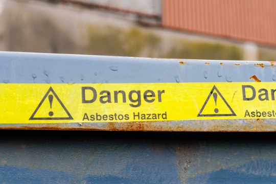 warning-tape-across-a-bin-at-an-asbestos-clean-up.jpg-540x360