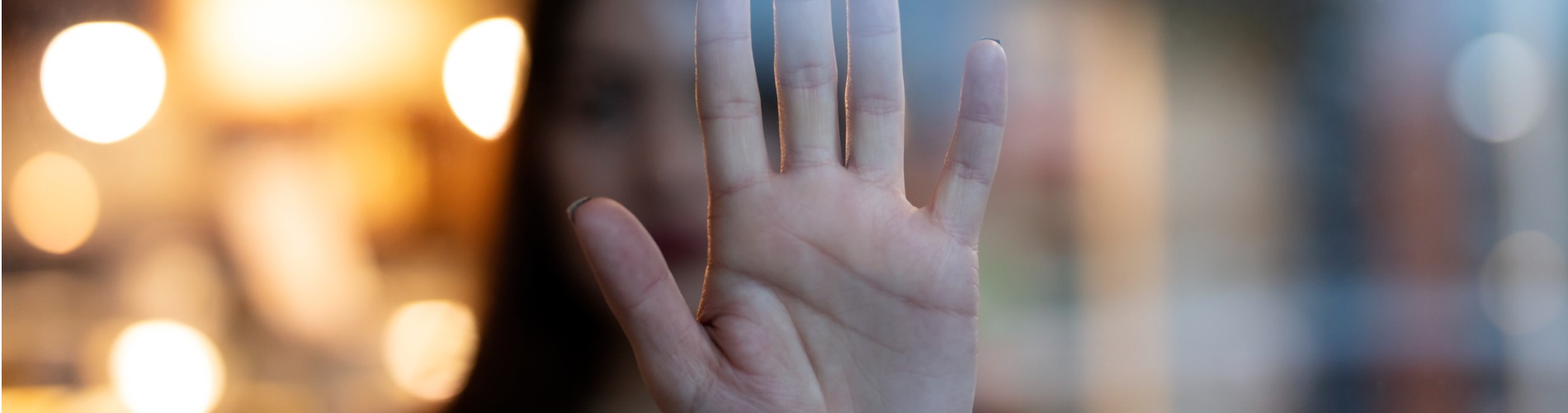 woman-showing-gesture-stop-violence-against-women 1900 x 500